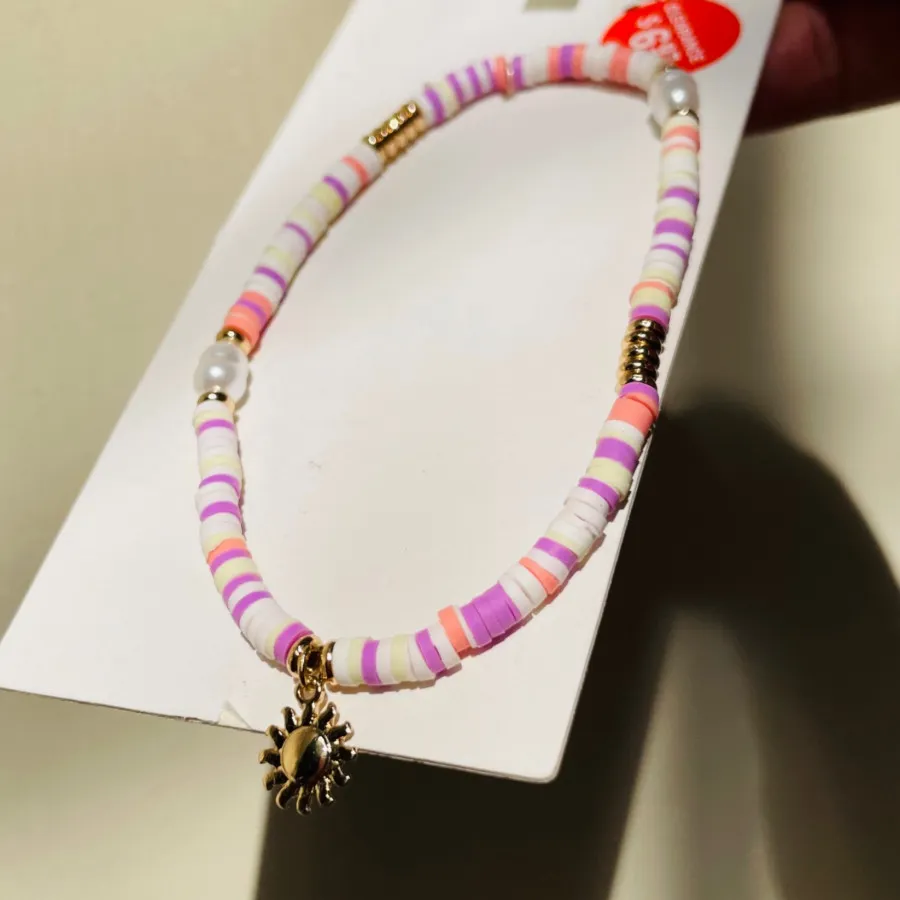 پابند مهره های رنگی