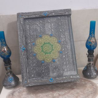 قرآن و چراغ گر سوز