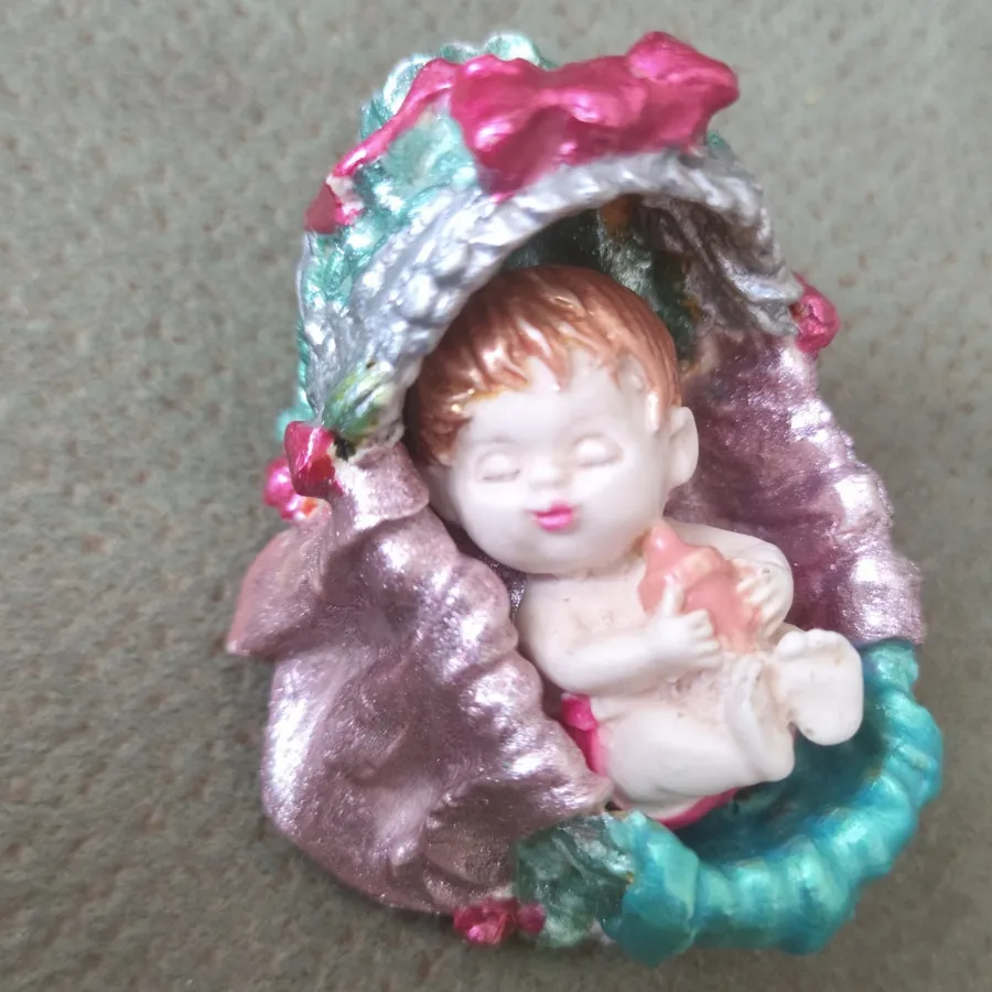 مجسمه  سنگی گهواره