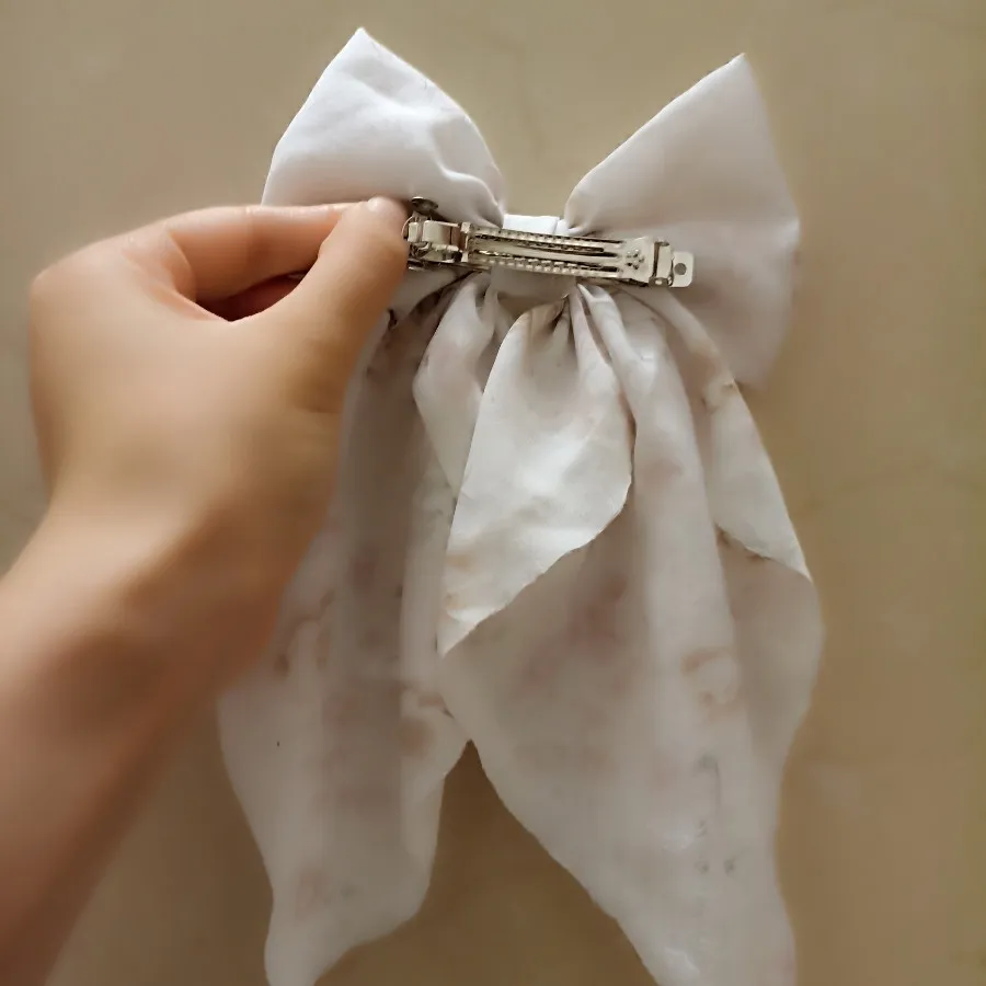 گیره پاپیونی دنباله دار