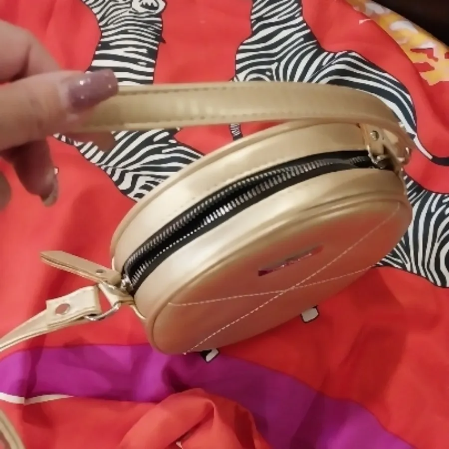 کیف طلایی گرد×××فروش رفت×