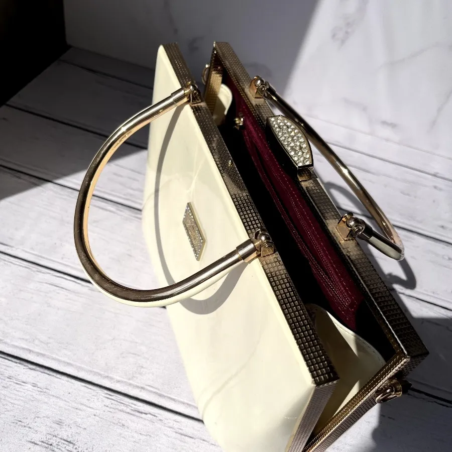 کیف مجلسی چرم و طلایی