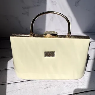 کیف مجلسی چرم و طلایی