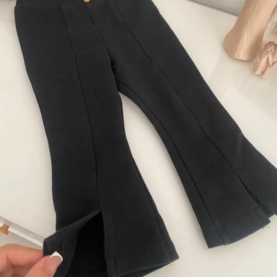 شلوار مشکی جلوچاکدار کودک