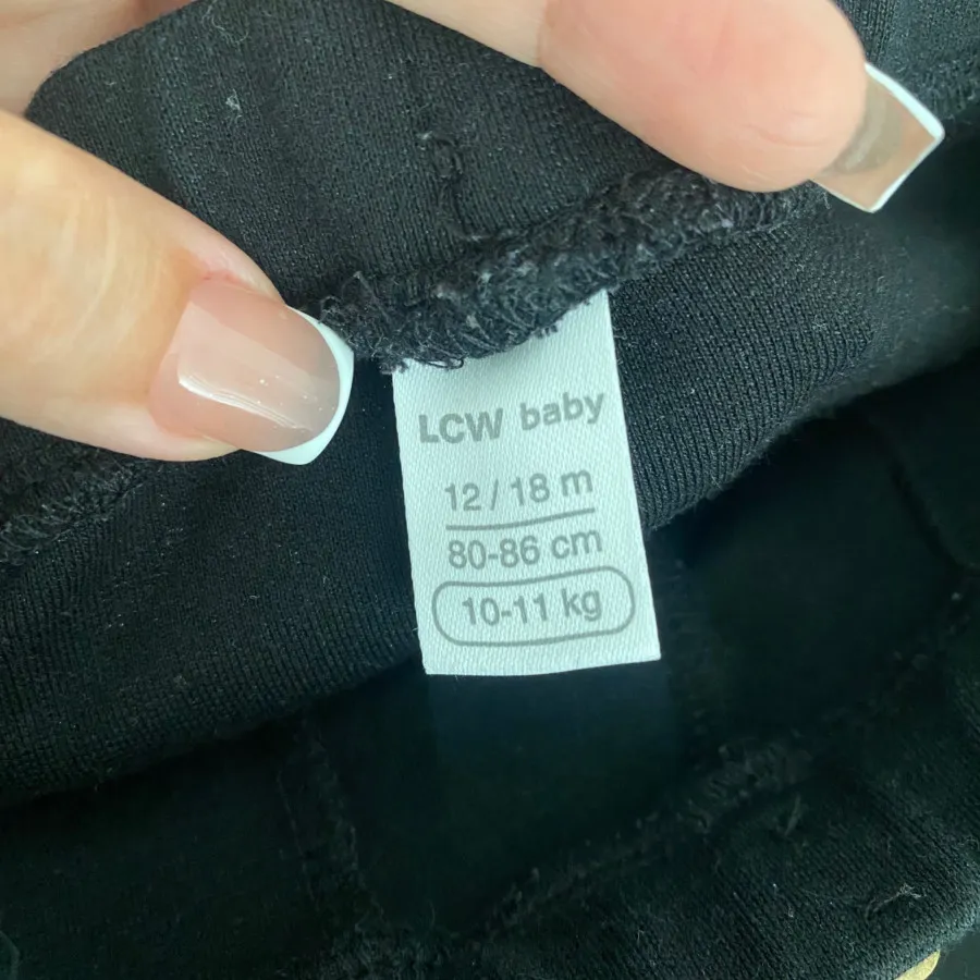 شلوار مشکی جلوچاکدار کودک