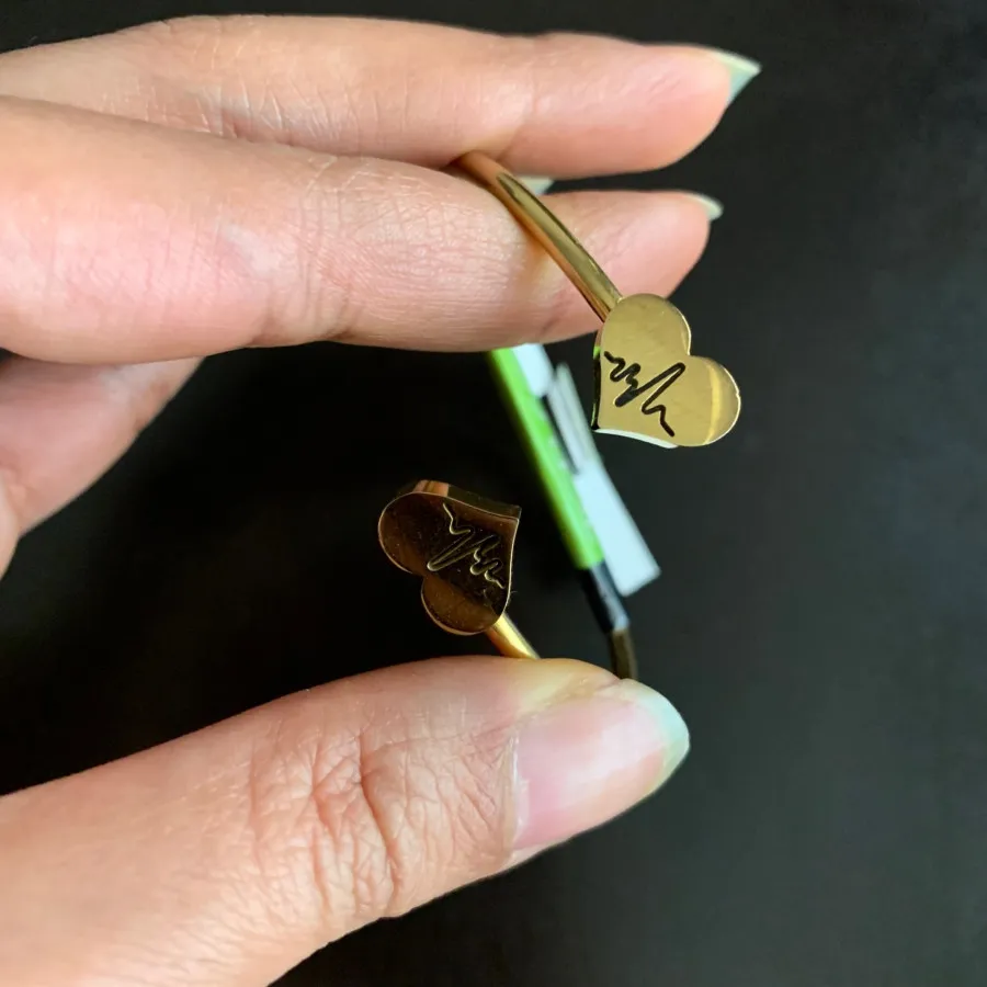 دستبند برند استیل طلایی