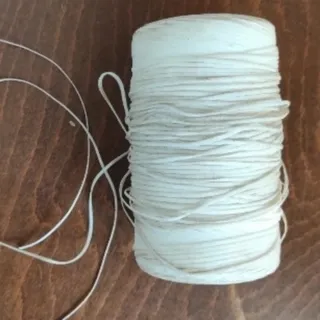 دوک‌ نخ  موم خورده