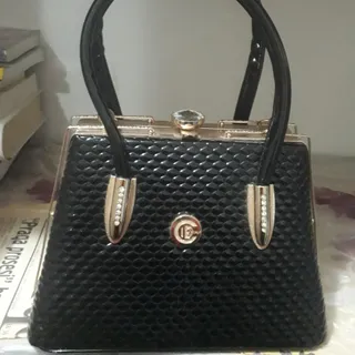 کیف ورنی پوست ماری