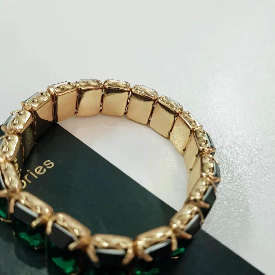 دستبند کشی طلایی نگین سبز