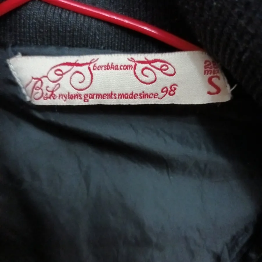 کاپشن مشکی برشکا طرح چرم