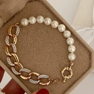 دستبند مروارید و کارتیر