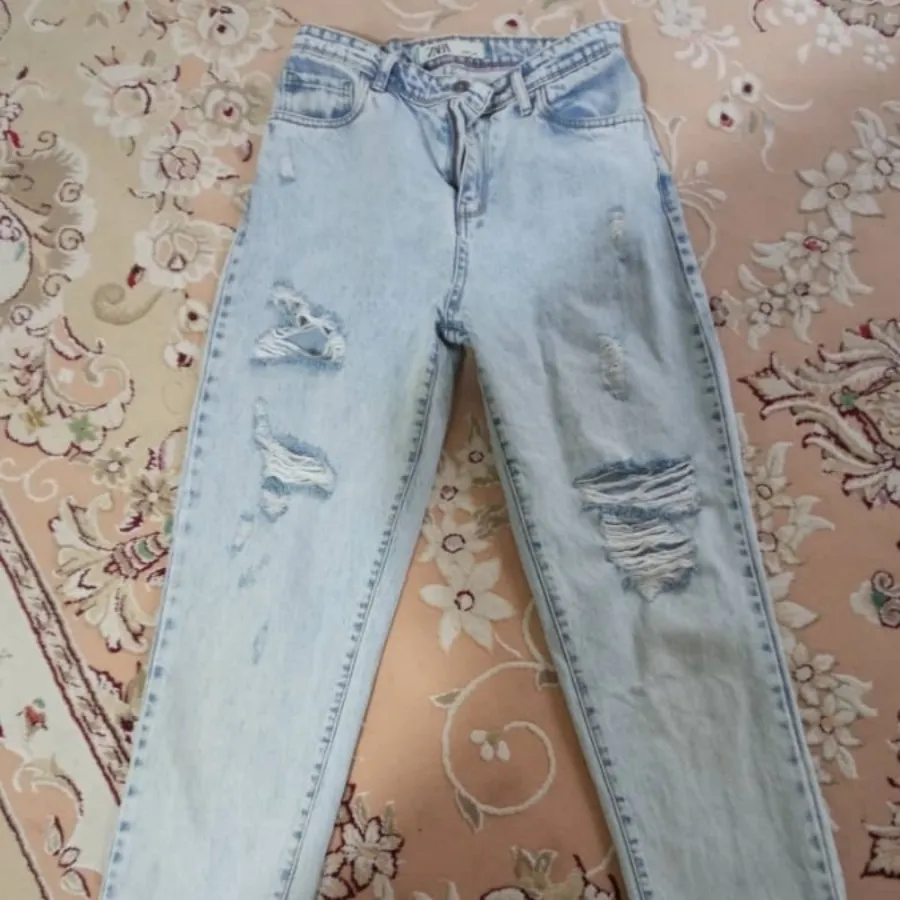 شلوار جین زخمی