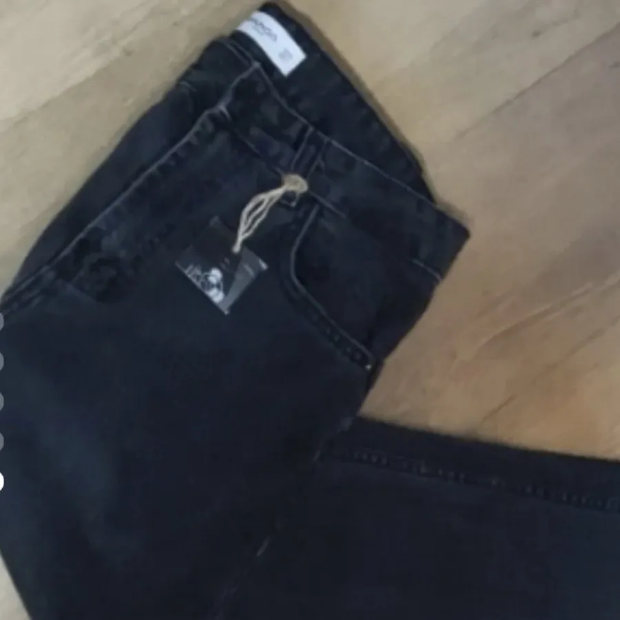 شلوار جین زغالی