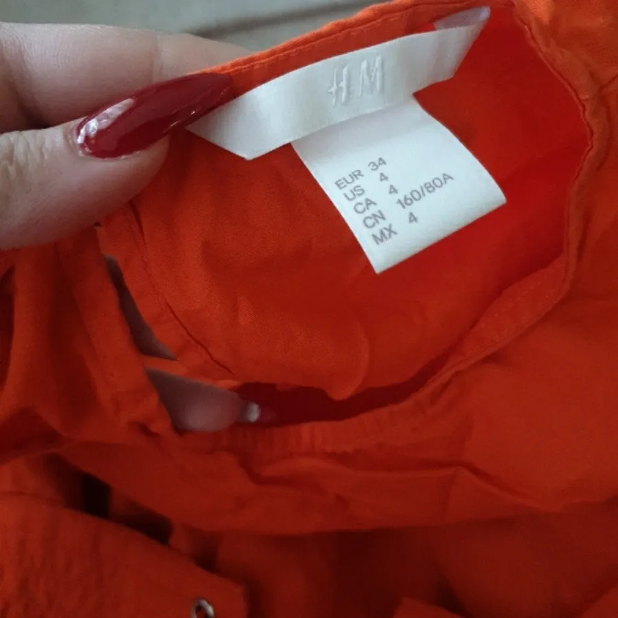 تیشرت نارنجی اچ ان ام