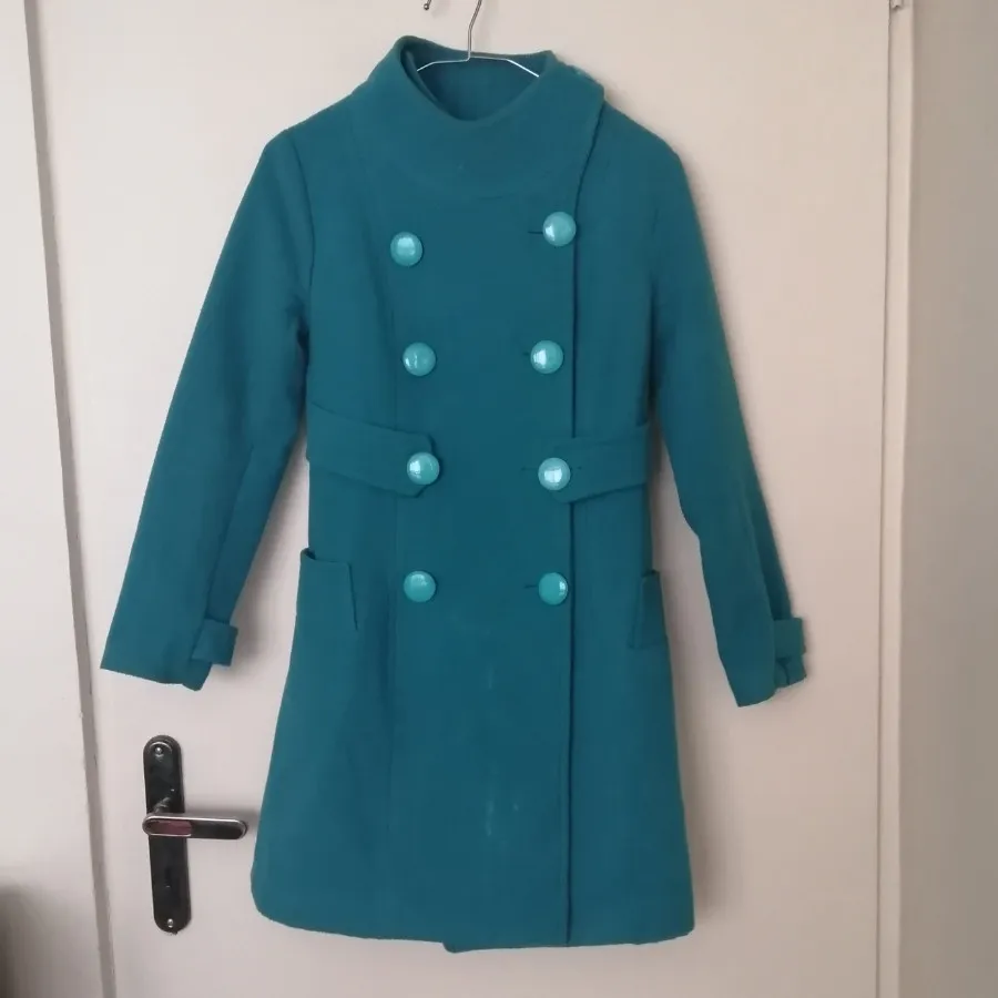 پالتو آبی فیروزهای هرمس