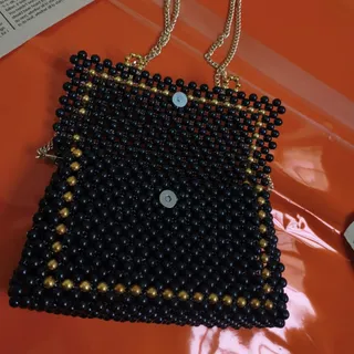 کیف مرواریدی مشکی طلایی