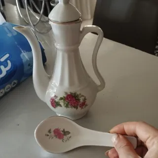 گلاب پاش و قاشق گل سرخ