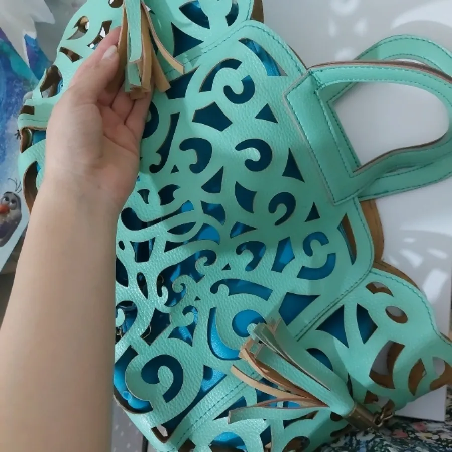 کیف چرمی برش خورده فیروزه
